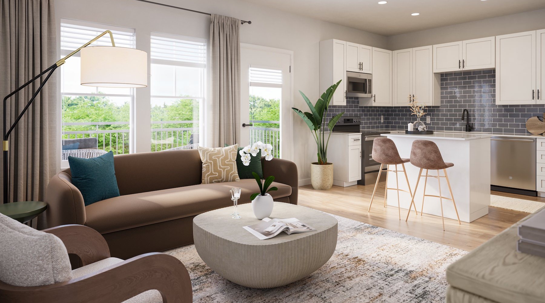 a kitchen and living room with a couch and chairs