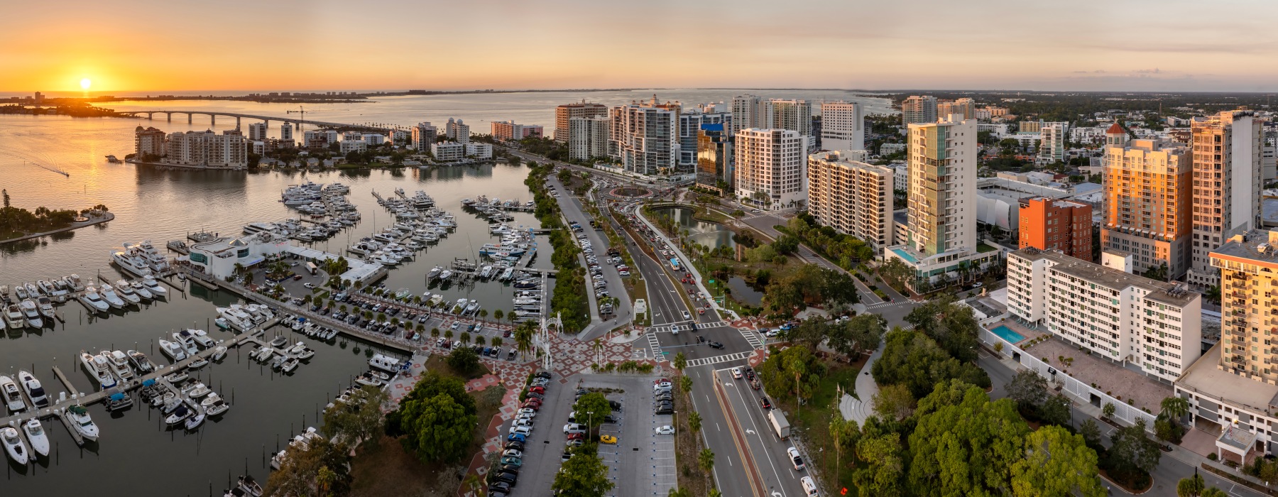 sarasota skyline sunset water high rise buildings roads boats