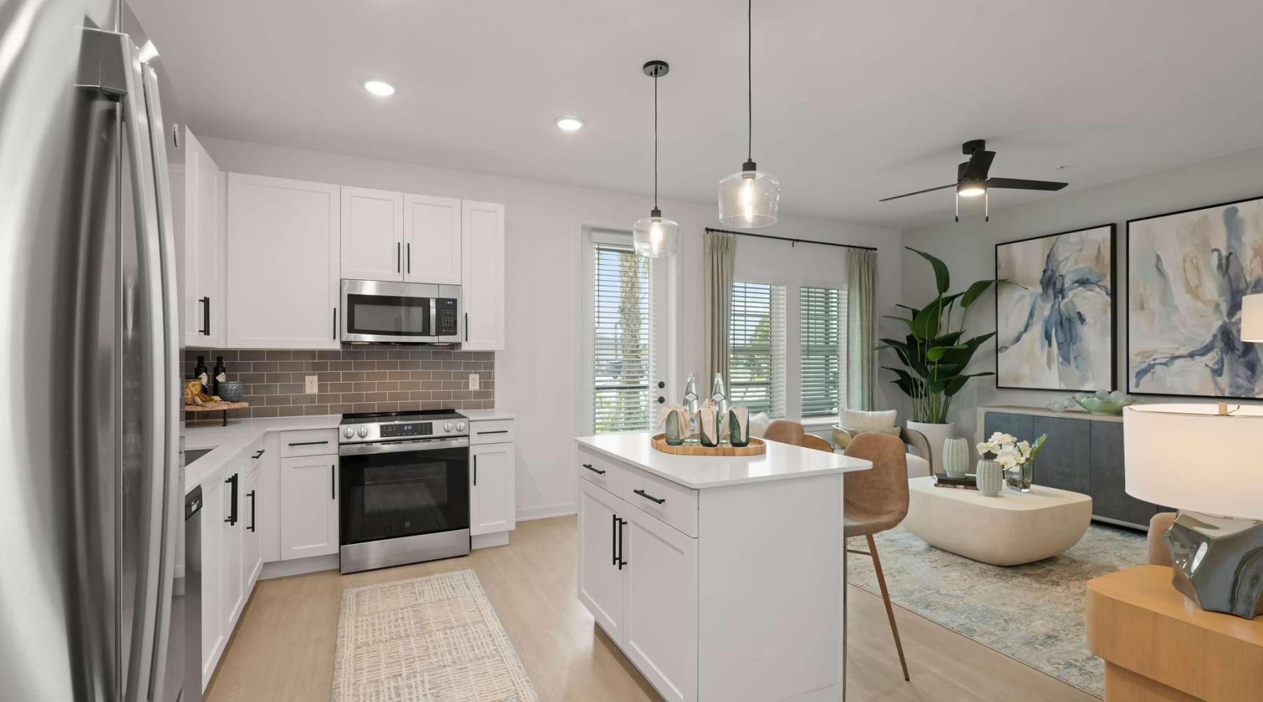 melina sarasota model apartment home island kitchen living area 